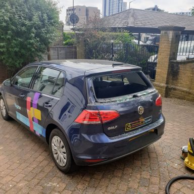 A vibrant car parked by the roadside, showcasing its unique paint job. Perfect for Epic Windscreens glass replacement service